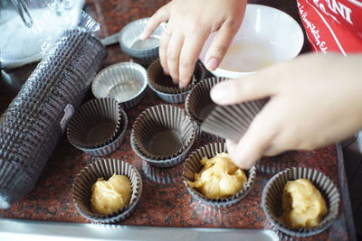 Midsection of person preparing food on table