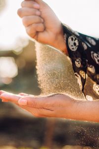 Close-up of woman hand holding water