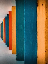 Close-up of multi colored wall by building