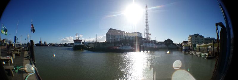 Boats moored at harbor