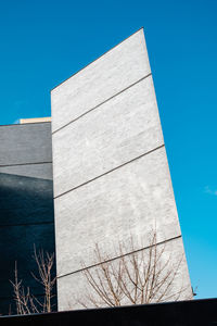 Low angle view of building against blue sky