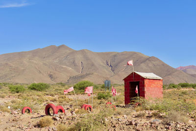 Scenic view of mountains against clear blue sky