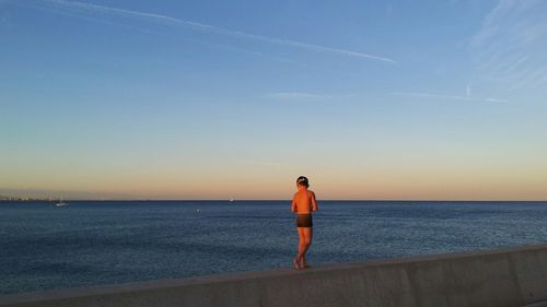 Scenic view of sea at sunset