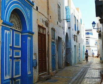 Man walking on cobblestone street