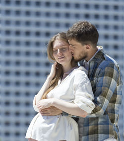 Young couple standing outdoors