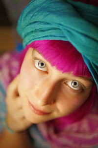 Close-up portrait of young woman with dyed hair