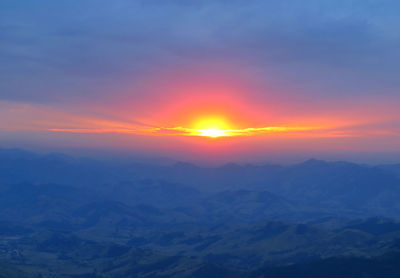 Scenic view of landscape against romantic sky at sunset