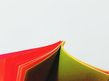 Close-up of multi colored pencils against white background