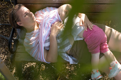 High angle view of mother and daughter on field