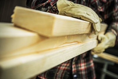 Midsection of man working at workshop