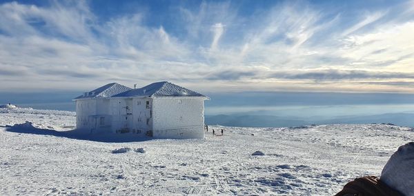 Built structure on snow covered land 