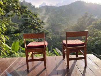 Empty chairs and tables in yard