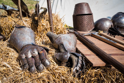 High angle view of medieval weapons on field