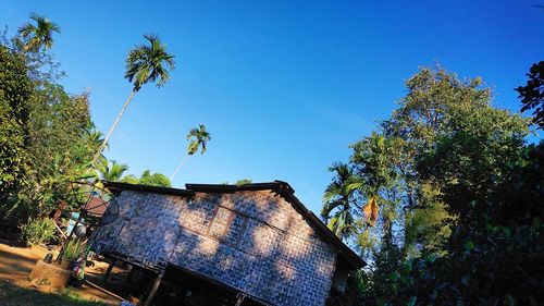 Low angle view of old building against clear blue sky