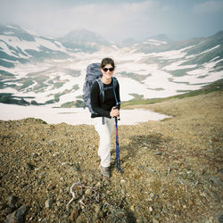 Portrait of man standing on snow