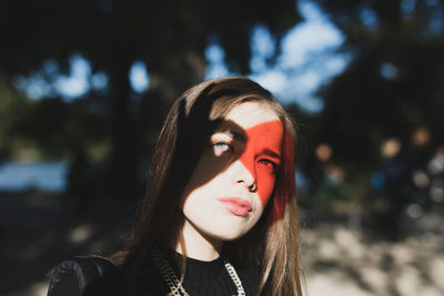 Red reflection on eyes of woman