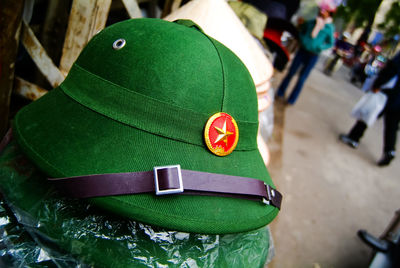 Close-up of green hats in market for sale