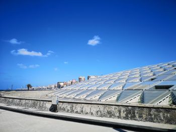 Low angle view of building against blue sky
