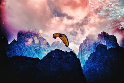 View of rock formation in water against sky