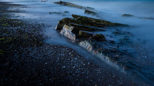 Rocks at shore of beach