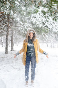 Portrait of a smiling woman in snow