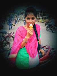 Portrait of woman eating food