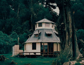 Abandoned house against trees