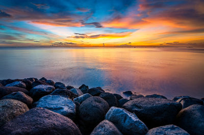 Scenic view of sea against sky at sunset