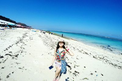 Woman standing on beach