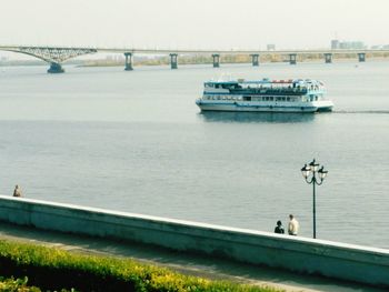 Bridge over sea against clear sky