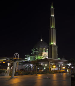 Illuminated cathedral against sky at night