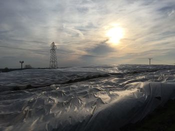 Scenic view of landscape against cloudy sky
