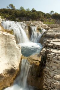 Scenic view of waterfall in forest