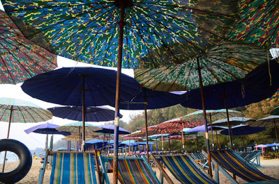 Tilt image of umbrellas hanging on beach