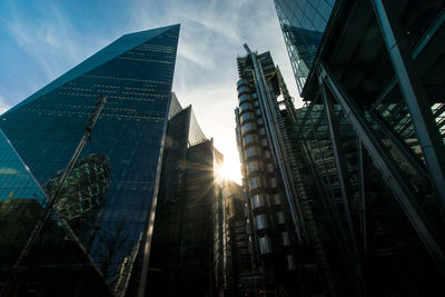 Low angle view of buildings against sky in city