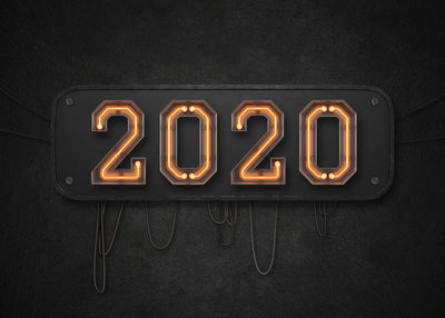 Close-up of illuminated lamp against black background