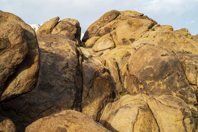 Low angle view of rocks against sky in desert landscape