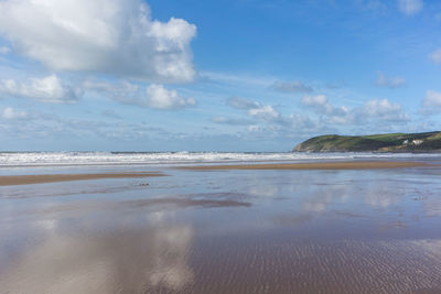 Scenic view of beach against sky