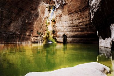 Close-up of rock formation in water