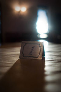 Close-up of illuminated text on table