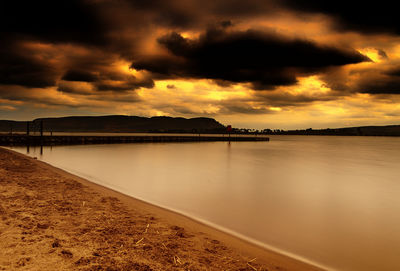 Scenic view of sea against cloudy sky