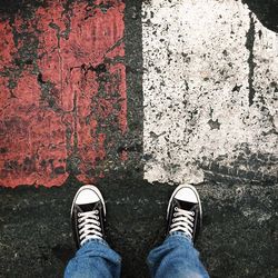 Low section of man standing on floor