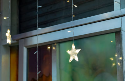 Close-up of christmas decoration hanging from ceiling