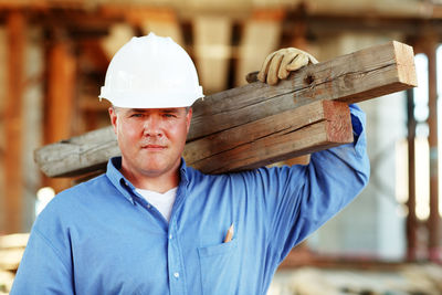 Portrait of man working at construction site