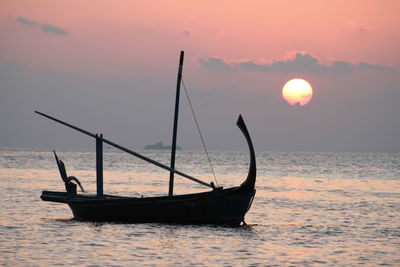 Silhouette of boat in sea