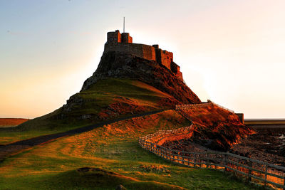 View of castle on mountain against sky