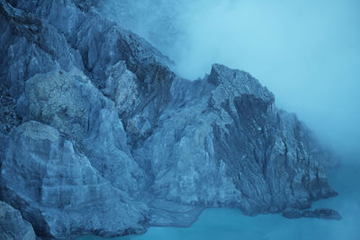 Scenic view of frozen lake against mountain