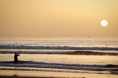 Scenic view of sea at sunset