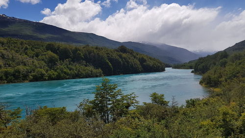 Scenic view of lake and mountains against sky