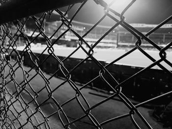 Close-up of chainlink fence at stadium